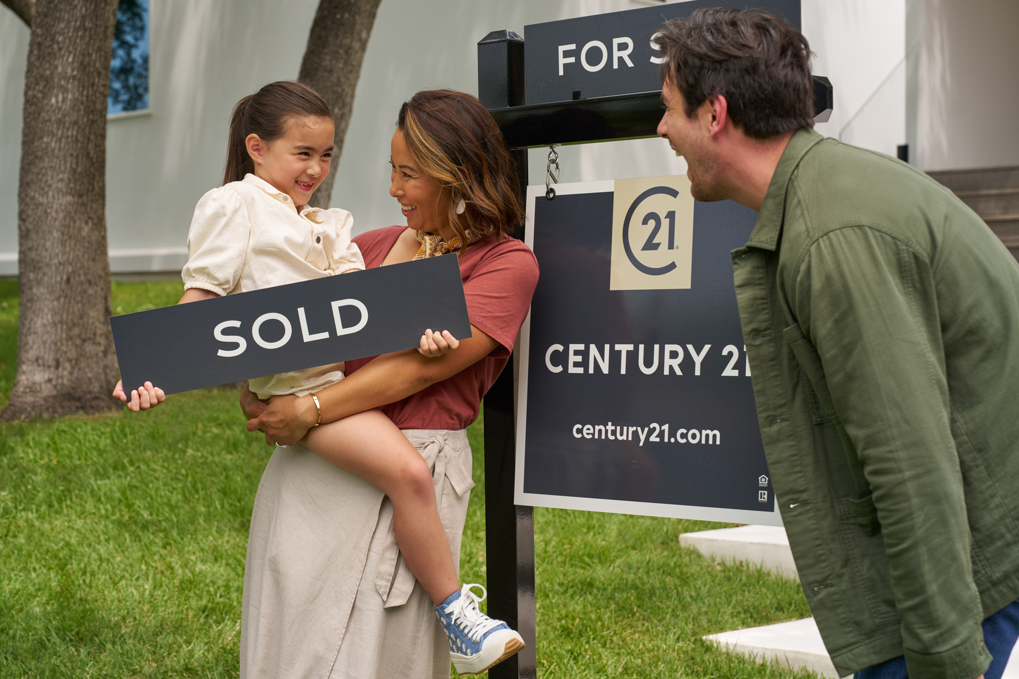 C21 Family With Sold Sign